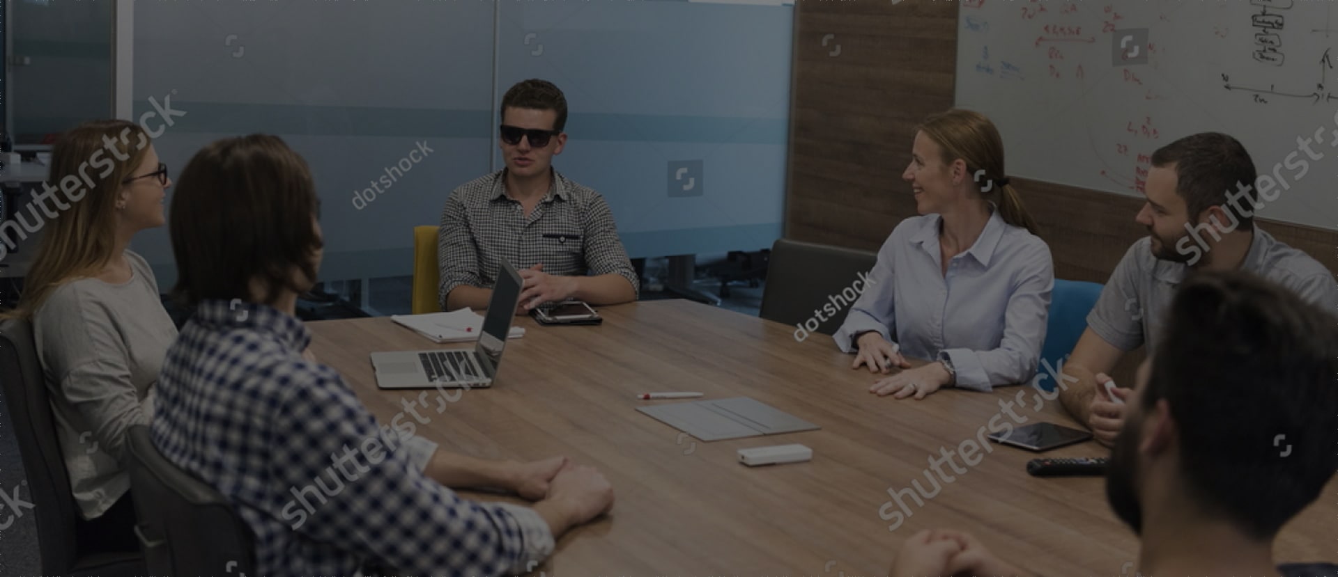 Picture demonstrating group of blind people discussion.